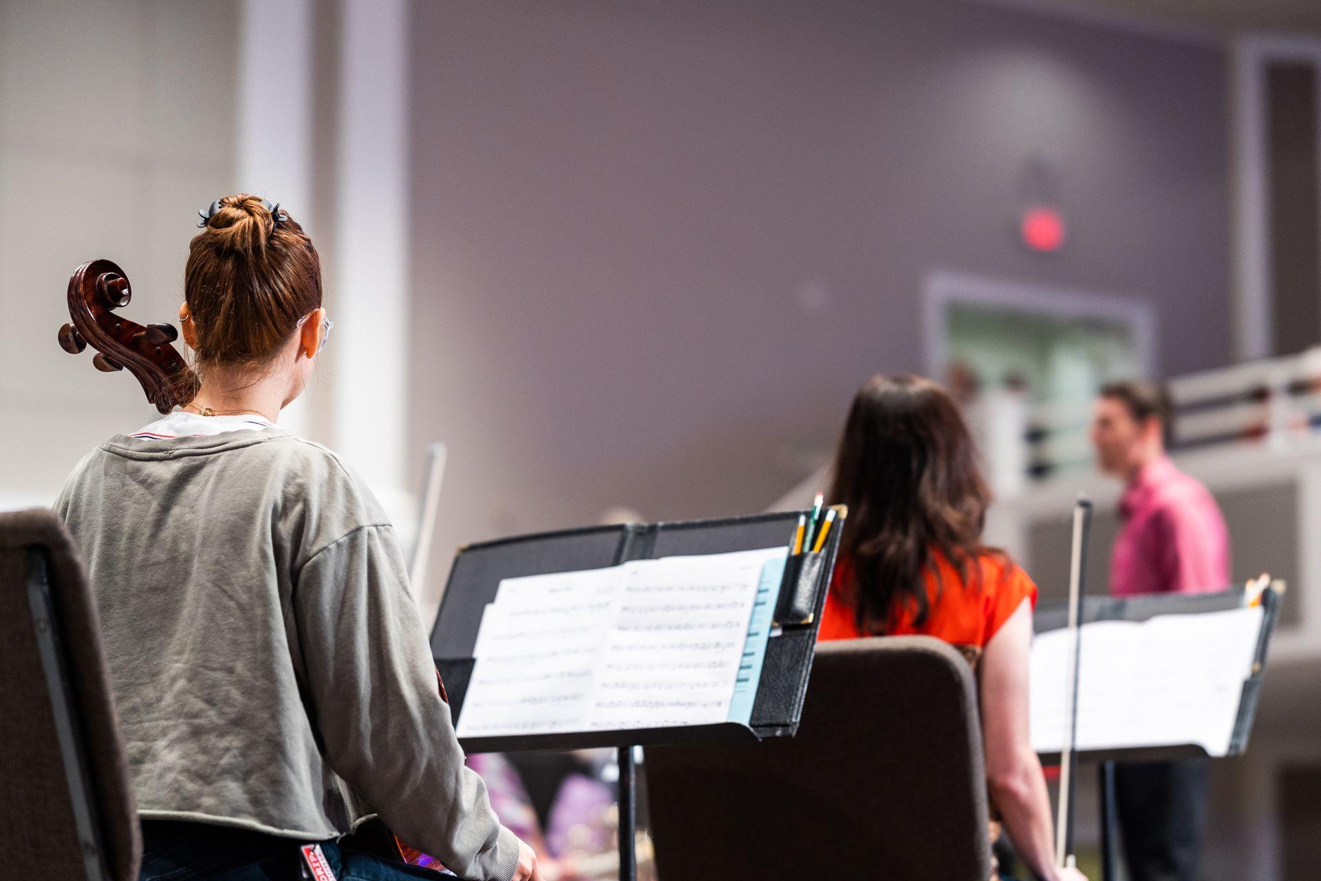 Students rehearsing together in a conservatory rehearsal room